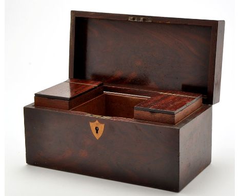 A late 18th Century mahogany tea caddy, rectangular with brass shield-shaped escutcheon, the lid opening to reveal two tea ca