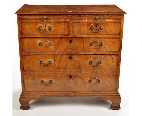 A late Georgian mahogany chest of two short and three long graduated drawers, fitted a baize-lined brush slide and moulded br