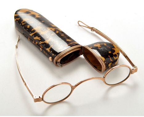A 19th Century gilt metal mounted tortoiseshell spectacle case, with engraved gilt metal panel decorated with the Sikes crest