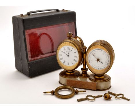 A Victorian desk top combination clock/barometer, by Reid & Sons, each in oval gilt metal case standing on onyx base, mounted
