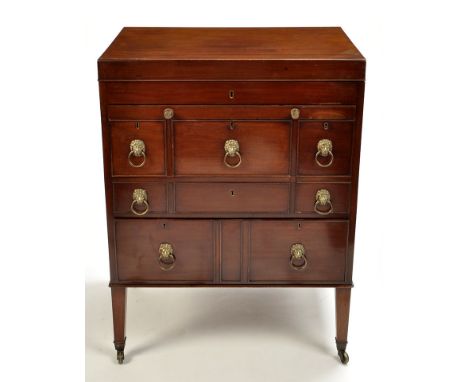 A fine quality late George III mahogany wash stand, the hinged top opening to reveal compartments and a central rising mirror