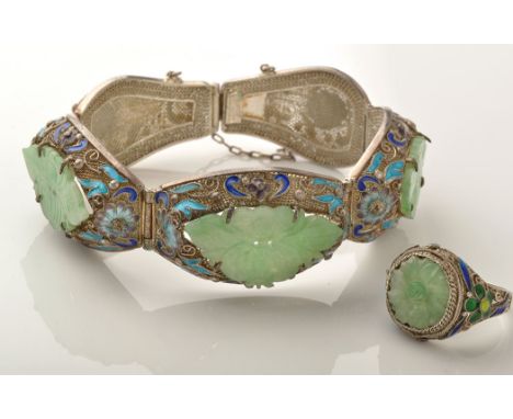 A Chinese silver enamel and jadeite matching bracelet and ring, the bracelet set with three carved and pierced floral panels 