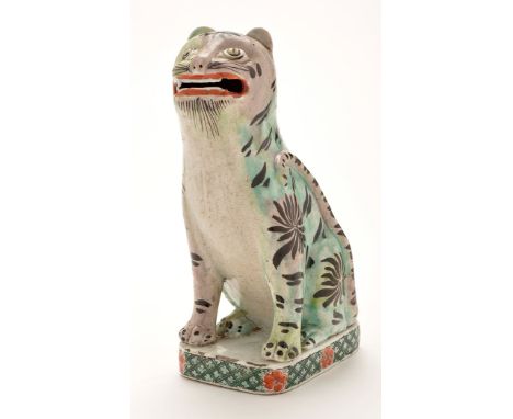 Chinese Famille Verte figure of a seated tiger, with raised head, open mouth and eyes looking upwards, raised tail resting ag
