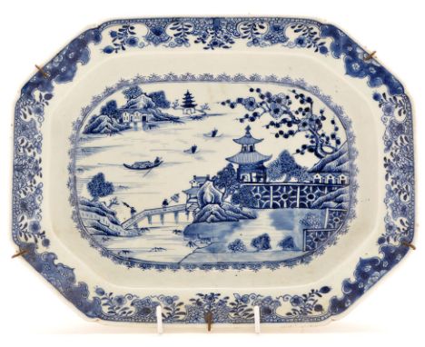 Chinese blue and white serving dish, painted with landscape having pavilion, fences, figures and boats, enclosed by scroll ar