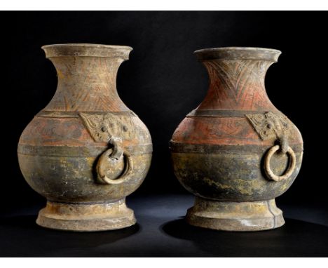 Large pair of Chinese painted pottery hu vases, each with twin moulded mythological beast handles, painted in red, ochre, gre