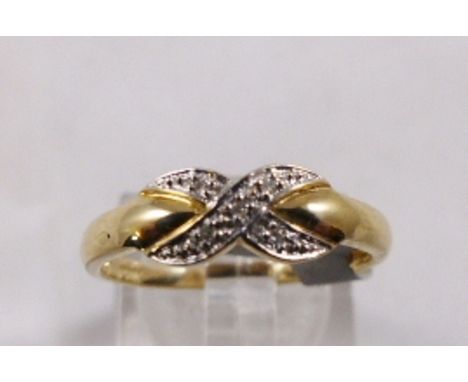 9CT DIAMOND RING. 9ct gold diamond set Kiss ring, size N