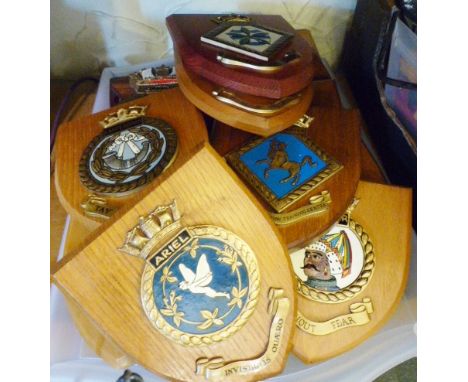 SHIPS CRESTS. Tray of Navy ships crests mounted on wooden shields