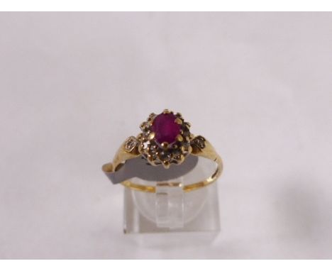 9CT RUBY AND DIAMOND RING. 9ct gold ruby and diamond cluster ring, size P