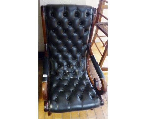 LEATHER ARMCHAIR. Black leather button back hardwood framed armchair