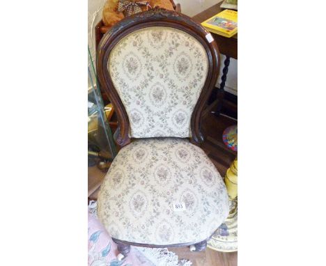 BEDROOM CHAIR. Small upholstered mahogany framed bedroom chair on turned front supports and ceramic castors