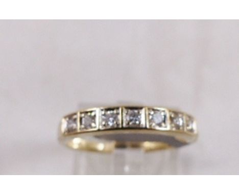 9CT DIAMOND RING. 9ct gold seven stone diamond half eternity ring, size P