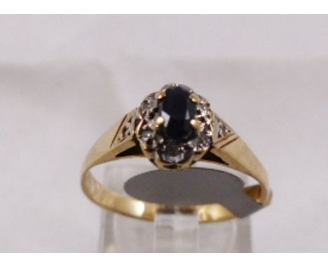 9CT SAPPHIRE AND DIAMOND RING. 9ct gold vintage sapphire and diamond cluster ring, size Q