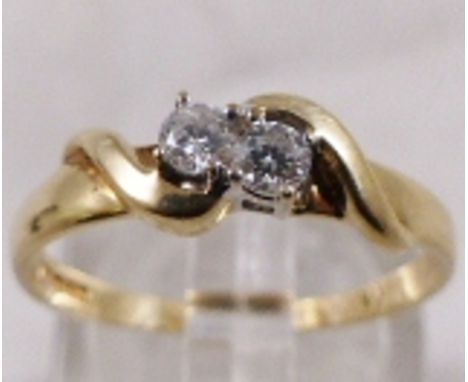 9CT RING SET. 9ct gold ring set with two brilliant cut diamonds, 0,2ct, size N