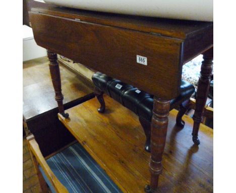 TROLLEY. Mahogany dropleaf trolley with turned supports on ceramic castors 