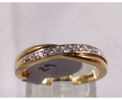 9CT DIAMOND RING. 9ct gold diamond crossover half eternity ring, size O