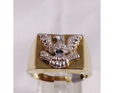 9CT DIAMOND RING. 9ct gold yellow and white gold diamond set eagle ring, size V