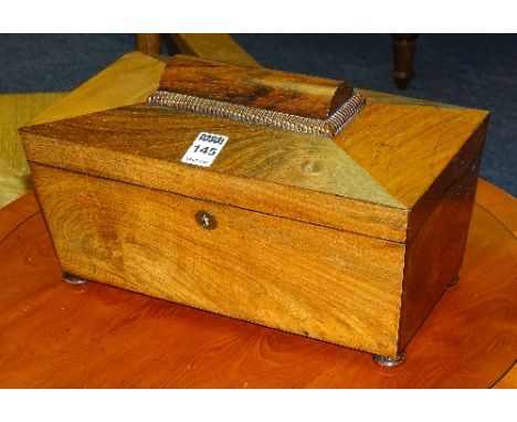 A William IV rosewood sarcophagus tea caddy, the hinged top enclosing two lids, lacking mixing bowl, raised on bun feet, 13.5