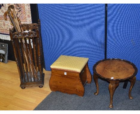 A carved stick stand, 72cm high, together with six assorted walking canes, hinged pine stool and a walnut circular occasional