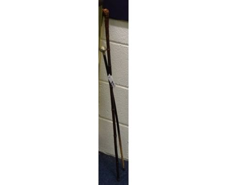 A bamboo sword stick, with indistinct makers name stamped to blade, 88cm long, together with a black painted RAF swagger stic