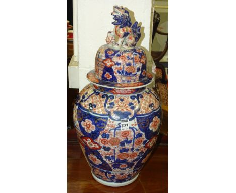 A Japanese Imari vase with cover circa late 19th century, decorated allover with blue and red foliate patterns on white groun