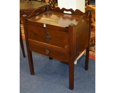 A George III mahogany inlaid night commode, with gallery top above two panelled doors and single drawer, 80cm high x 59cm wid