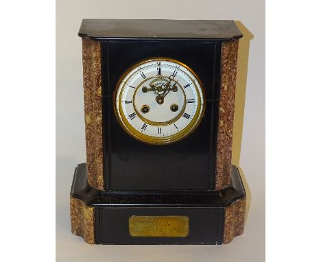 A late Victorian black slate and marble mantel clock, with twin train movement, the white enamel dial with Roman numerals, pr