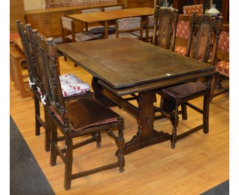 A vintage pull out dining table, 73cm high x 134cm long, 174cm fully extended x 89cm wide, together with four similar bergere