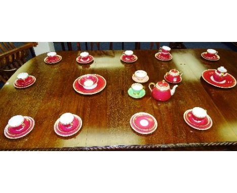 A Spode 'Ryde' teaset, with gilt and white decoration on red ground, together with two Foley china cups and saucers (a lot)
