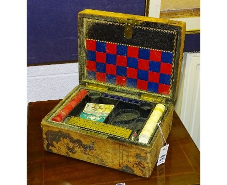 A 19th century compendium by J Milne of Edinburgh, to include bone counters, ebony dominoes, wooden counters, leather checker