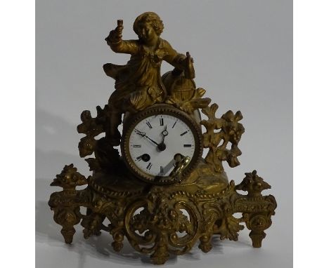 A French gilt spelter eight day mantel clock, circa late 19th/early 20th century, with figural surmount above 3 inch white en