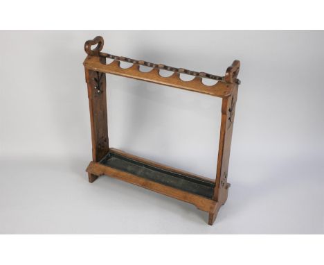 A Late 19th Century Arts and Crafts Oak Stick/Umbrella Stand with Integral Carrying Handles and Decorative Pierced Ends, 24x7