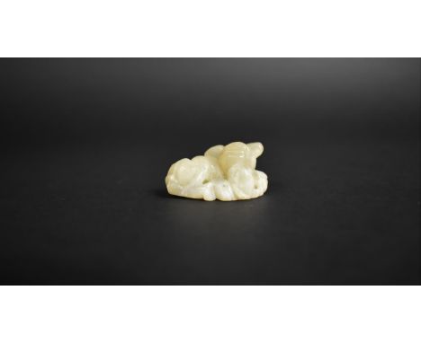 A Small White Jade Type Chinese Hardstone Carving of Temple Lion, 4x2cms High 