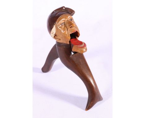 Well carved painted novelty wood nut cracker in the form of a man wearing a hat, early 20th century, 20cm