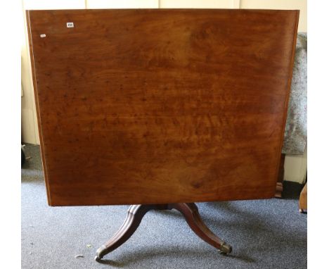 George III mahogany tilt top table raised on tripod base with two additional leaves. 136cm wide, 112cm wide, 74cm high (Leave