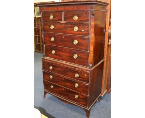 George III style mahogany chest on chest, the dentil projected moulded cornice over two short and six long drawers and brushi