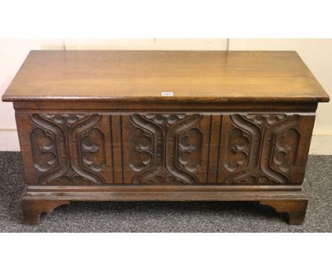 Gothic style oak coffer, the hinged rectangular top over carved panelled frieze, raised on bracket legs, 94x47x36cm.