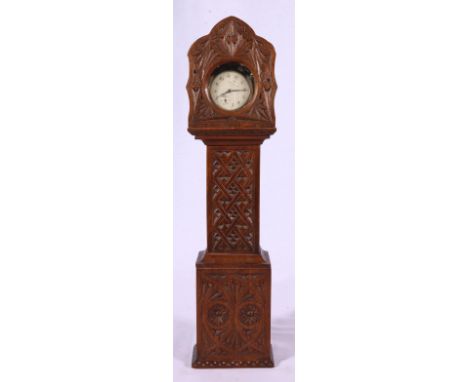 Carved oak watch case in the form of a longcase clock containing an Ingersoll pocket watch. 39cm high