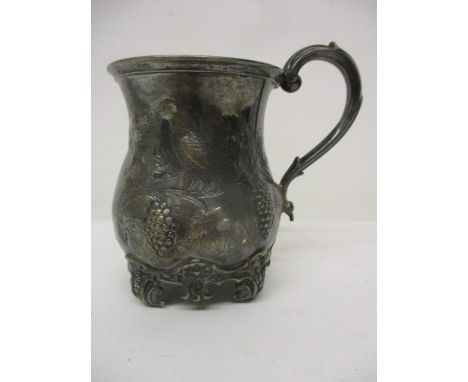 A Victorian silver christening mug by George John Richards & Edward Charles Brown, London 1862 of waisted form, embossed and 