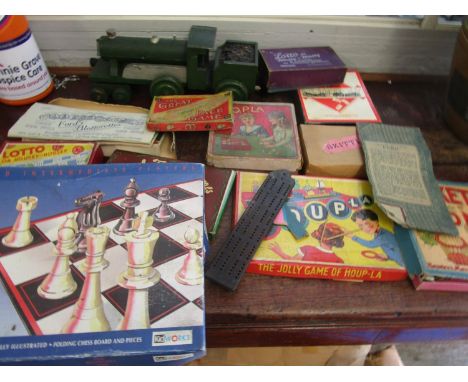 A selection of vintage games and a painted wooden train engine 