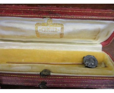 A vintage Cartier stick pin box, together with a yellow metal stick pin with a miniature Roman coin emblem 