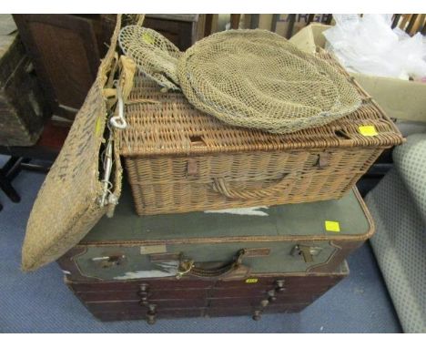 A Victorian mahogany chest of eight short drawers, a vintage canvas suitcase, a wicker hamper and a cane fishing reel with a 