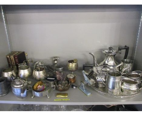 A candelabra and other metalware, and four leather bound books, together with a silver plated tea set and a tankard 