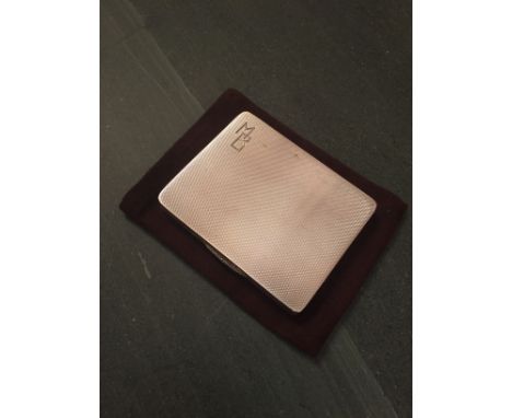A silver engine turned cigarette case, initialled MB, Birmingham 1940
