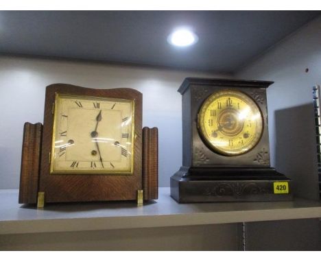 A Victorian slate mantel clock, together with an Edwardian oak framed mantle clock 