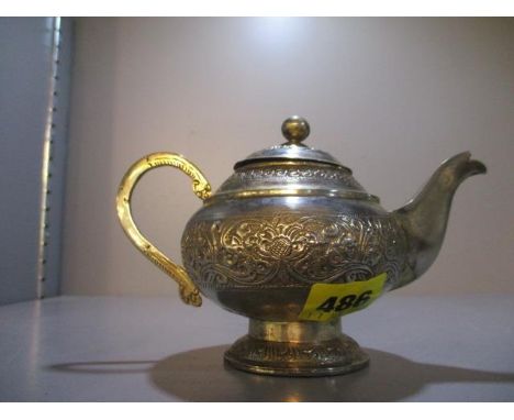 An Indian white metal teapot 