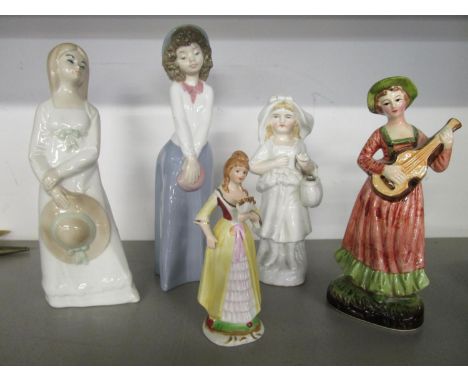 A group of porcelain figures to include Nao 