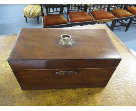A Georgian mahogany tea caddy with a fitted interior 