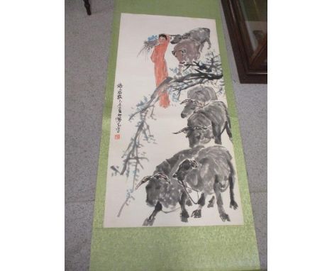 A Chinese scroll painting depicting a farmer and her cattle 
