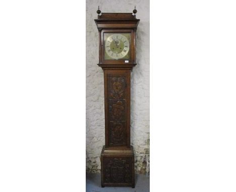 An early 18th century oak longcase clock, with eight day strike on bell movement, regulated by a pendulum, the brass and silv