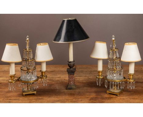 A pair of brass and lustre electrically converted candelabra; together with a brass and hardstone table lamp modelled as an u